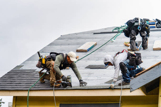 Professional Roofing technician working in Ames, TX